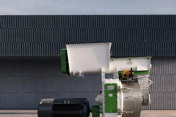 Peanut shell pellet mill machine on cement floor for biomass pellet production
